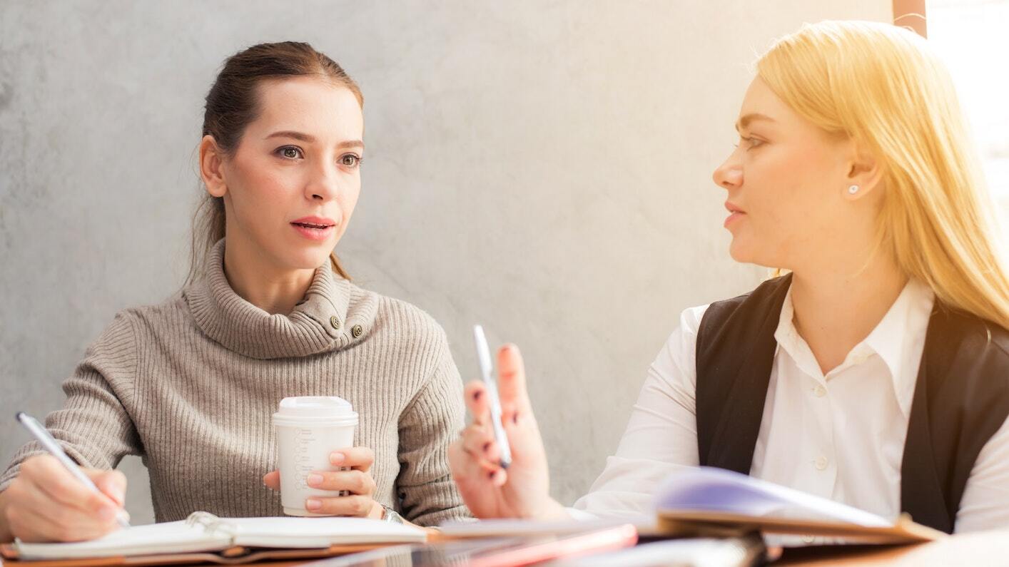 A picture of two people discussing